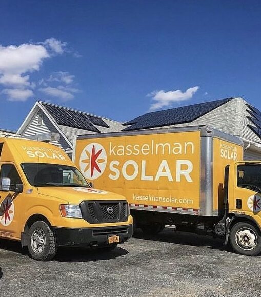Kasselman Solar vans and trucks at solar installation site